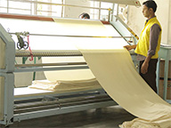 Manufacturer photo of man in yellow shirt operating machine Manufacturer photo of man in yellow shirt operating machine